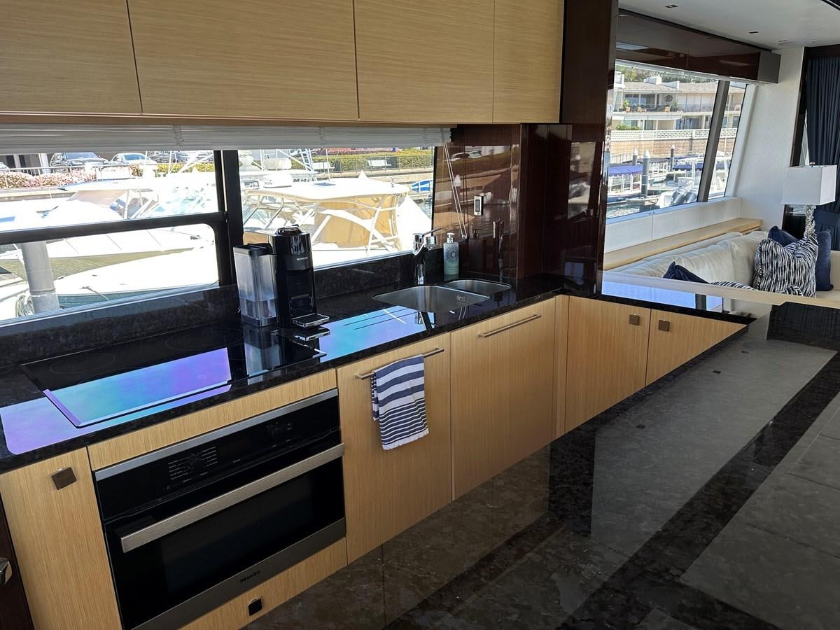 a kitchen with a large window aboard K NUK Yacht for Sale