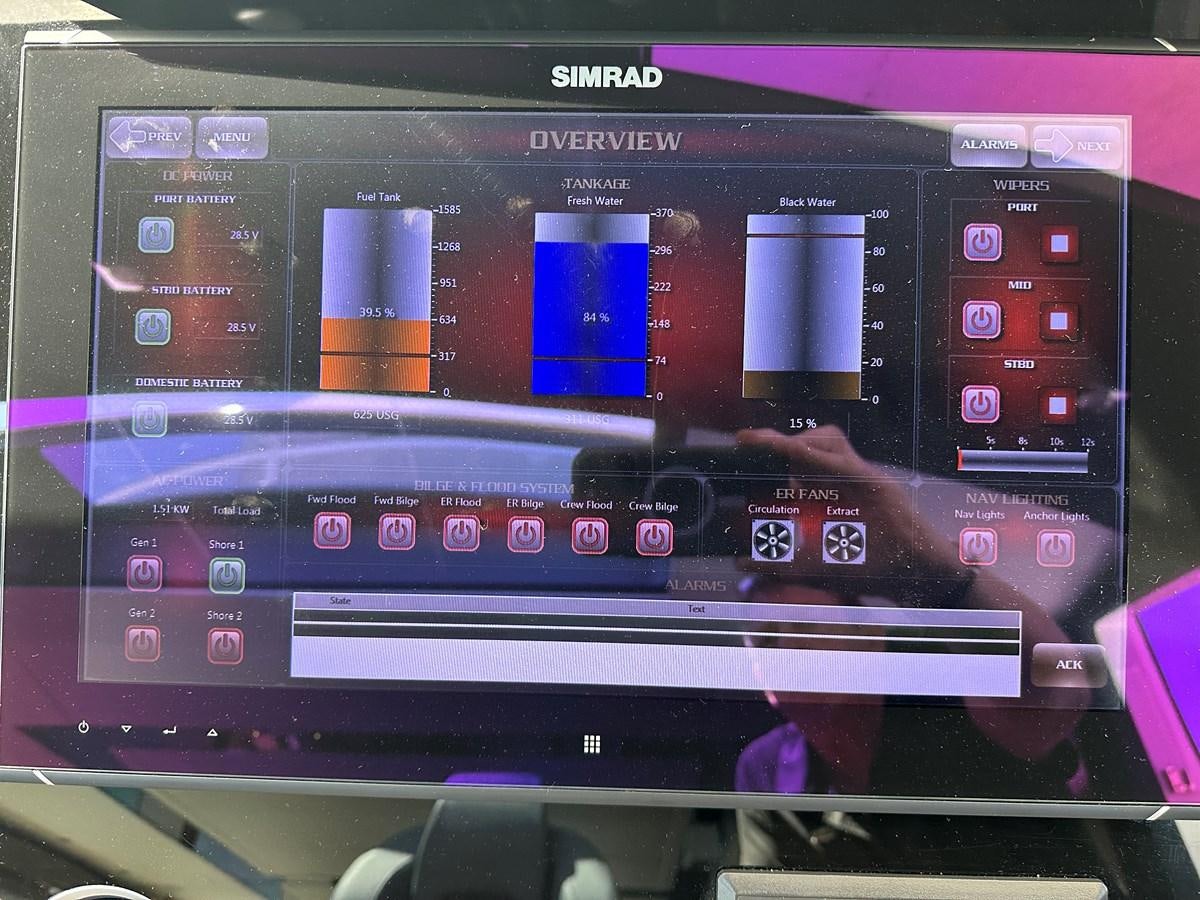 a person holding a camera aboard K NUK Yacht for Sale