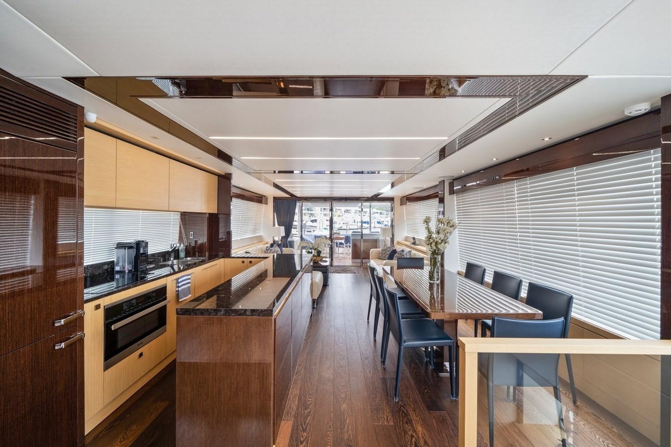 a kitchen with a table and chairs aboard K NUK Yacht for Sale