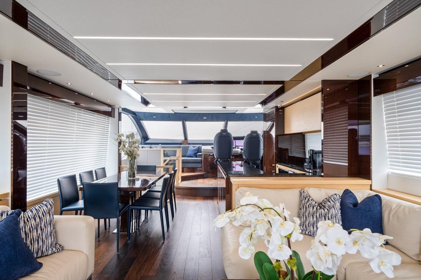 a room with a table chairs and a large window aboard K NUK Yacht for Sale