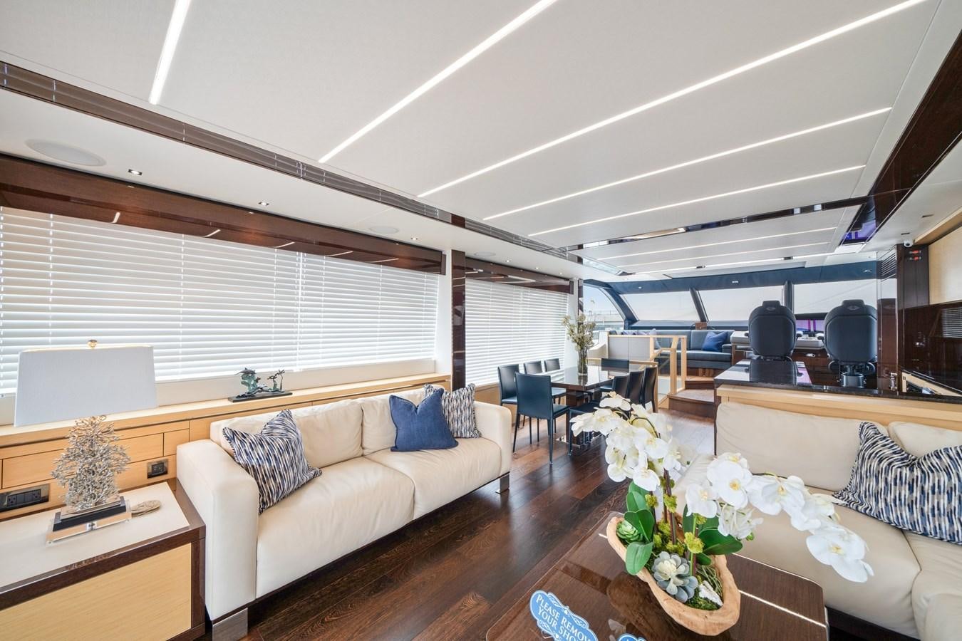 a living room with a couch and a table aboard K NUK Yacht for Sale