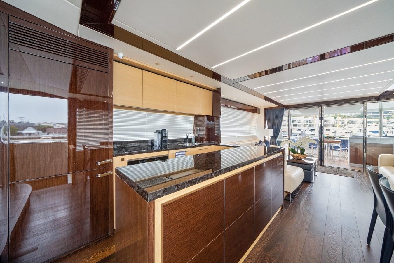 a kitchen with wooden cabinets aboard K NUK Yacht for Sale