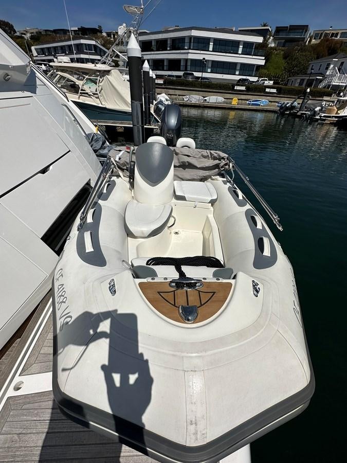 a white boat with a black and white design on it aboard K NUK Yacht for Sale