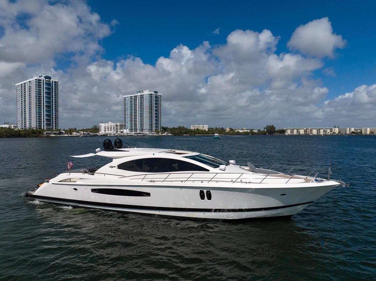 a white yacht in the water aboard XCELL Yacht for Sale