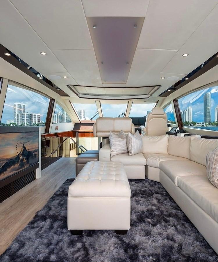 a large living room with a large window aboard XCELL Yacht for Sale