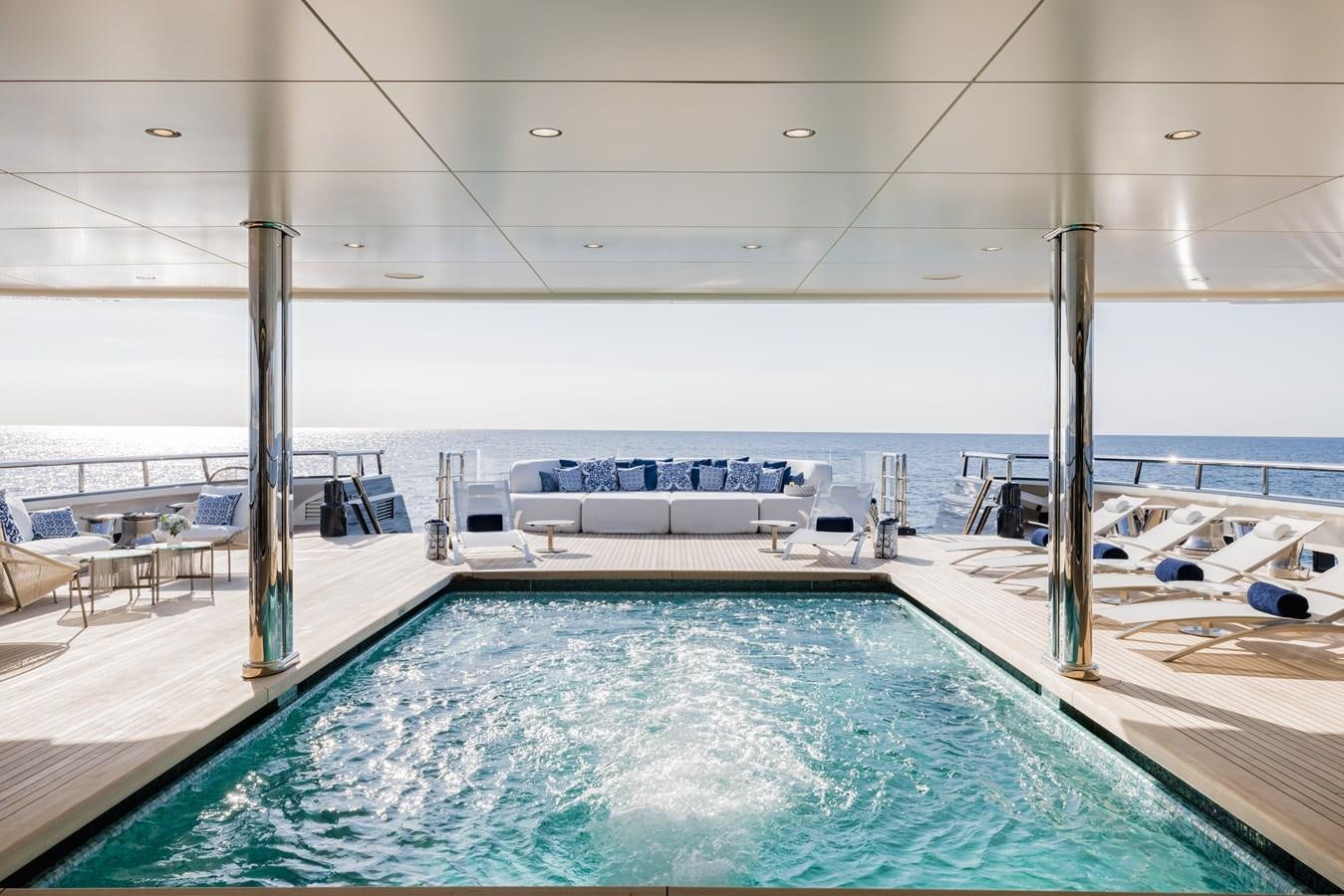 a swimming pool in a large room aboard HERE COMES THE SUN Yacht for Sale