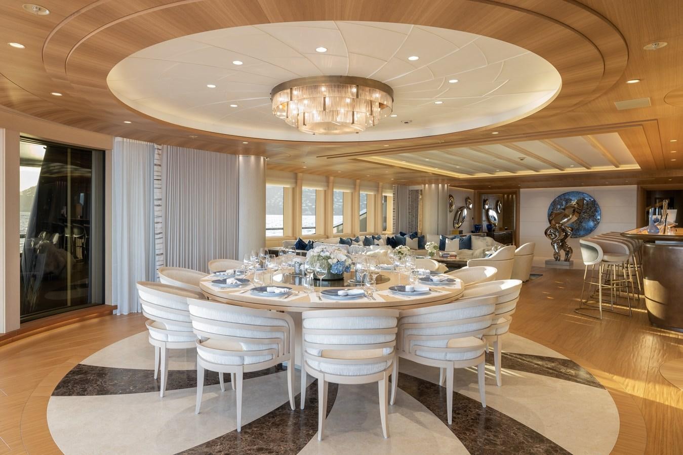 a large dining room with a large table and chairs aboard HERE COMES THE SUN Yacht for Sale