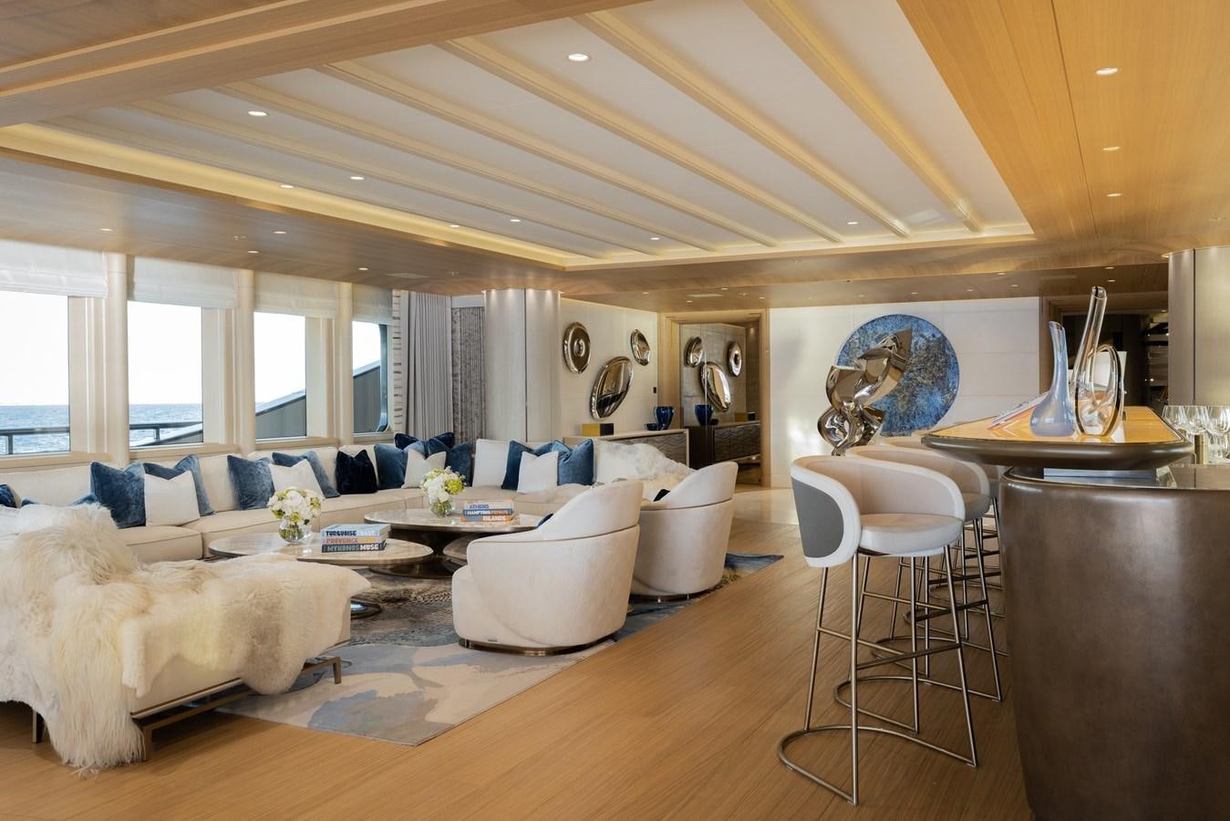 a living room with a large window aboard HERE COMES THE SUN Yacht for Sale