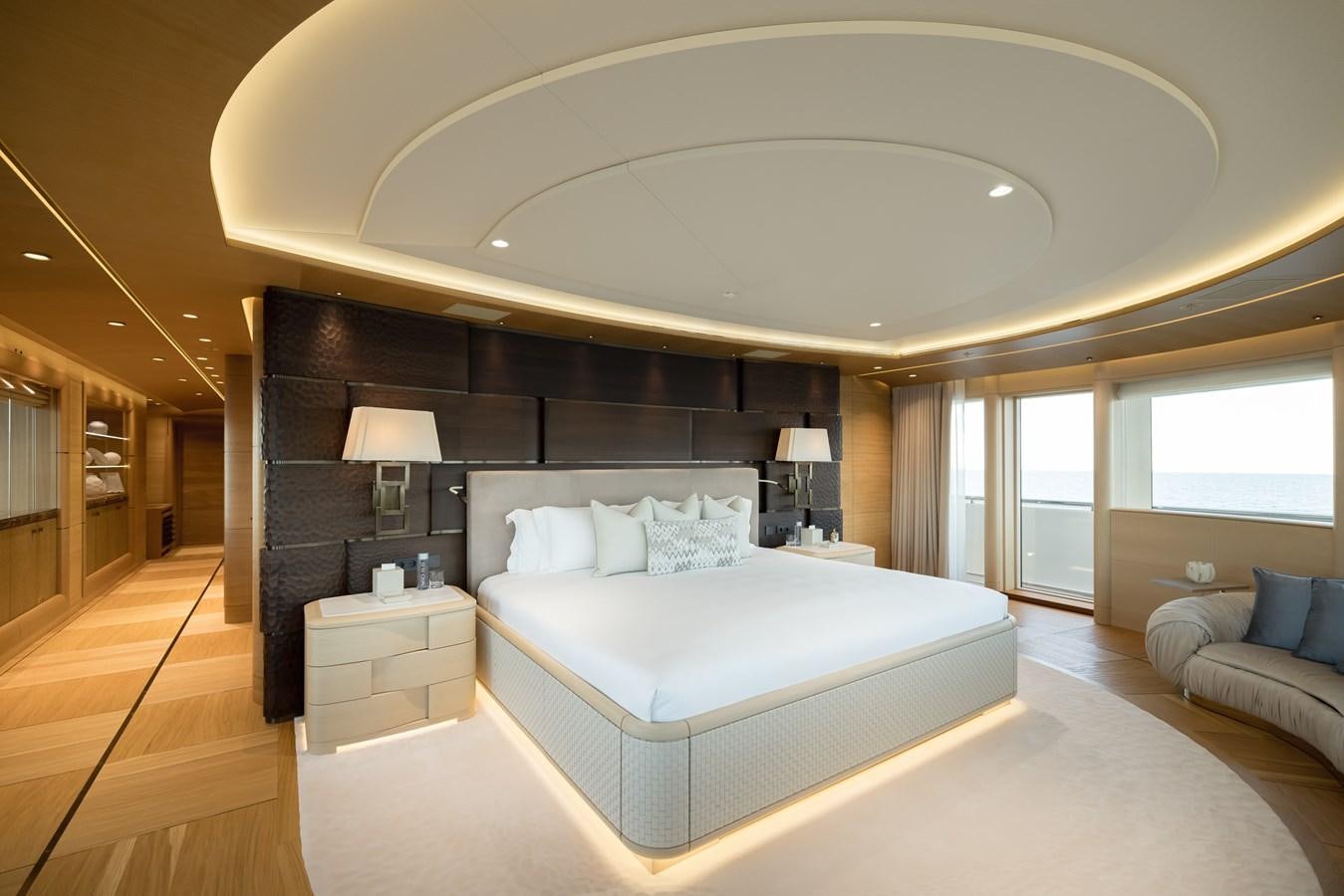 a large bedroom with a large bed aboard HERE COMES THE SUN Yacht for Sale