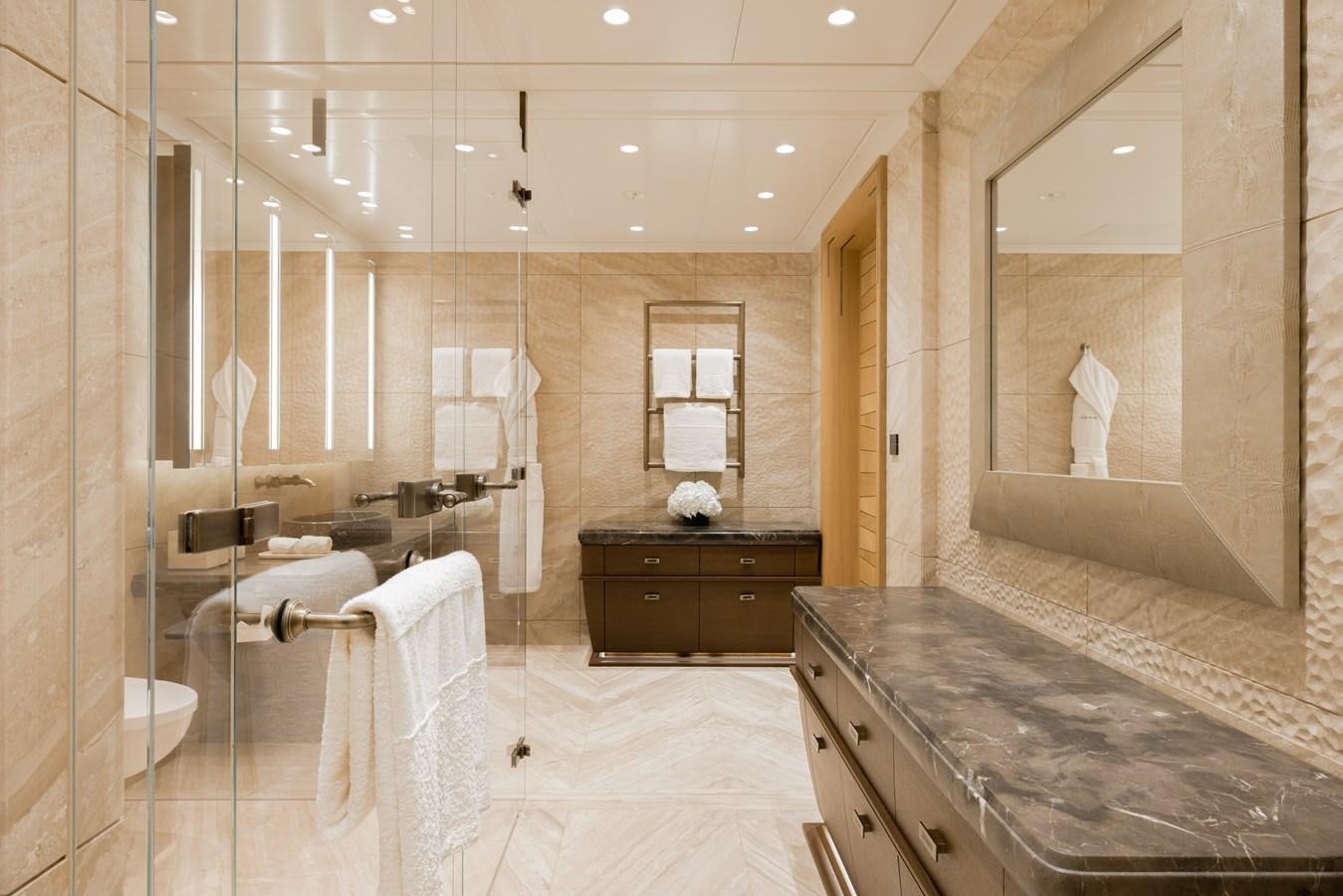 a bathroom with marble counter tops aboard HERE COMES THE SUN Yacht for Sale