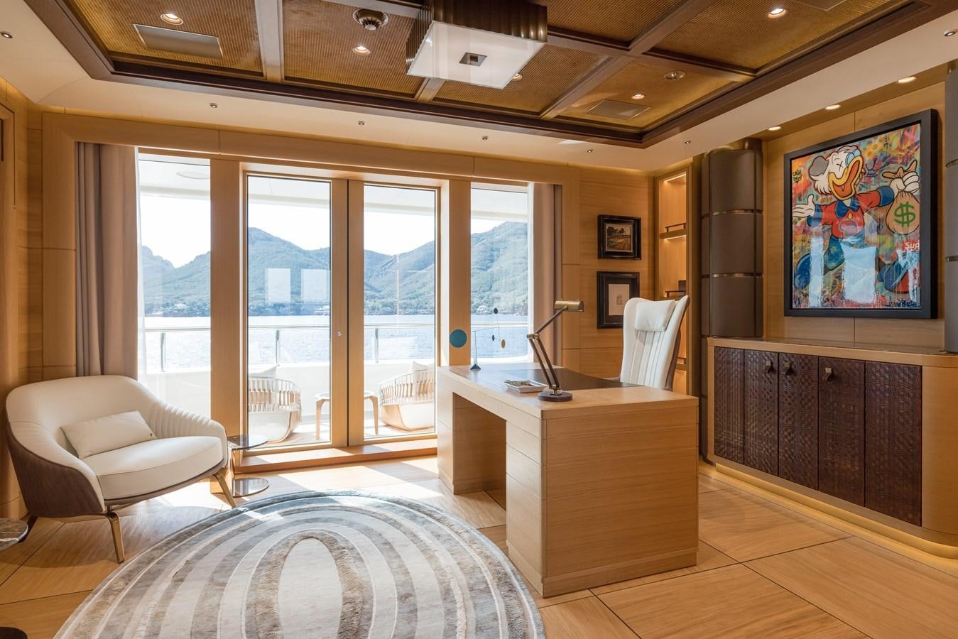 a large room with a large window and a view of the ocean aboard HERE COMES THE SUN Yacht for Sale