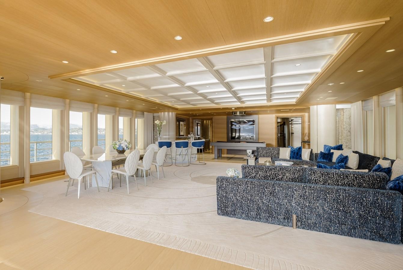a large living room with a large open floor plan aboard HERE COMES THE SUN Yacht for Sale