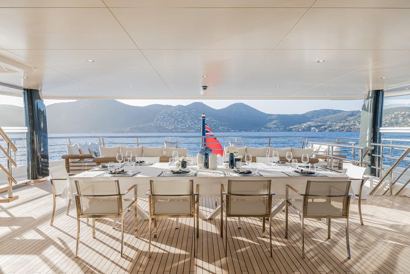 a table set for a meal aboard HERE COMES THE SUN Yacht for Sale