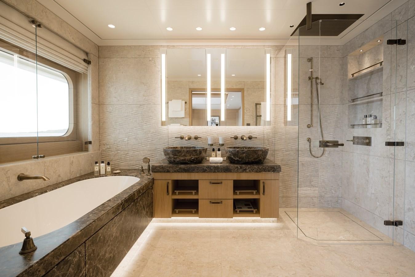 a bathroom with a large tub aboard HERE COMES THE SUN Yacht for Sale