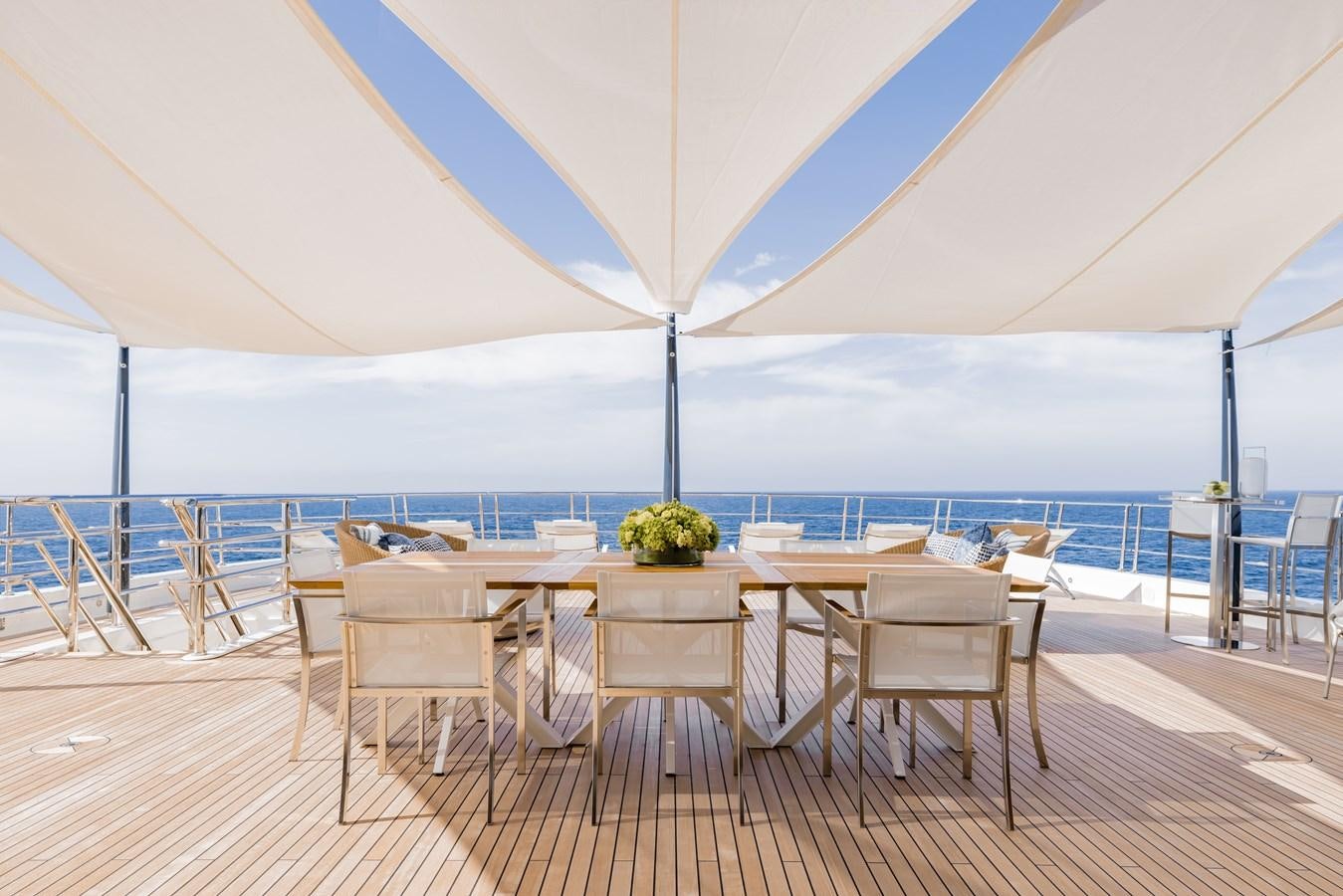 a table set for a meal aboard HERE COMES THE SUN Yacht for Sale