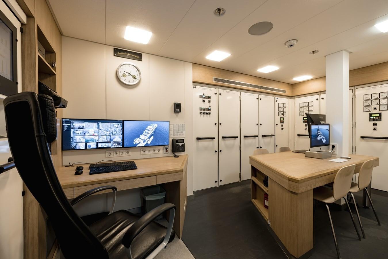 a room with computers and chairs aboard HERE COMES THE SUN Yacht for Sale
