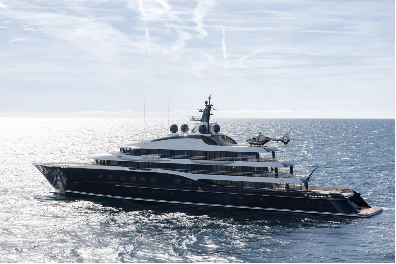 a large boat in the water aboard HERE COMES THE SUN Yacht for Sale