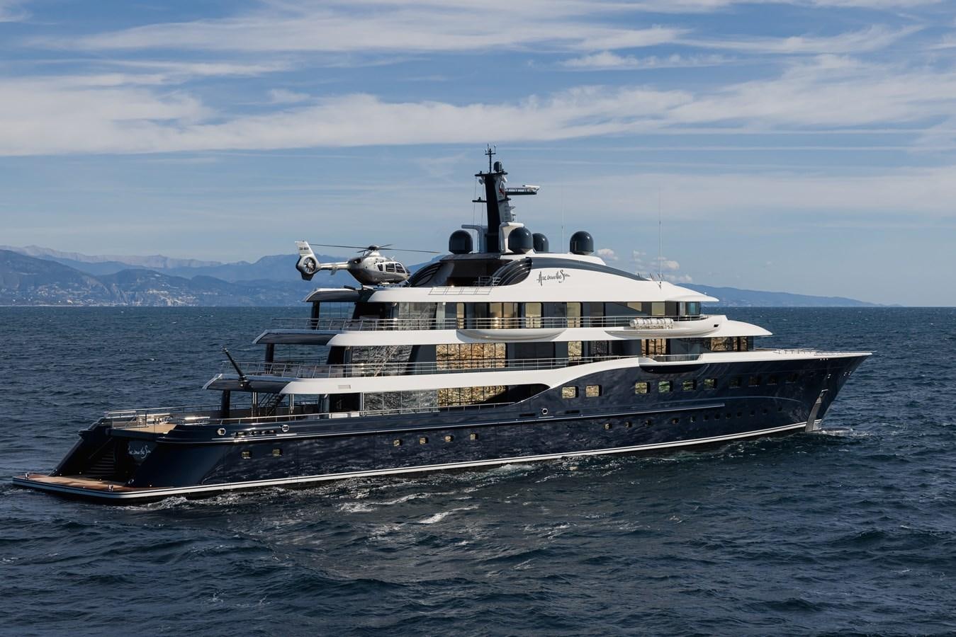 a large ship in the water aboard HERE COMES THE SUN Yacht for Sale