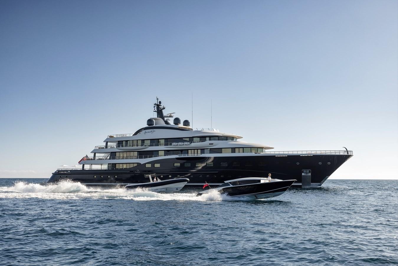 a large ship on the water aboard HERE COMES THE SUN Yacht for Sale