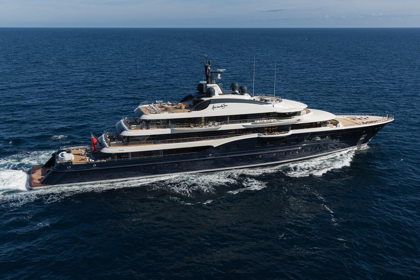 a large ship in the water aboard HERE COMES THE SUN Yacht for Sale