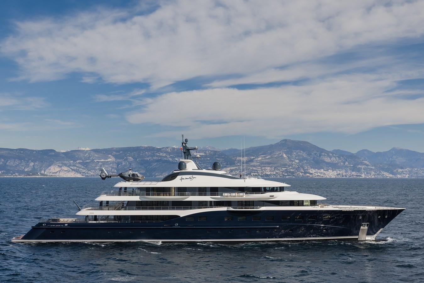 a large boat in the water aboard HERE COMES THE SUN Yacht for Sale