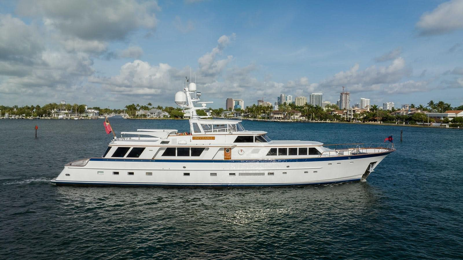 a white boat on the water aboard INEVITABLE Yacht for Sale