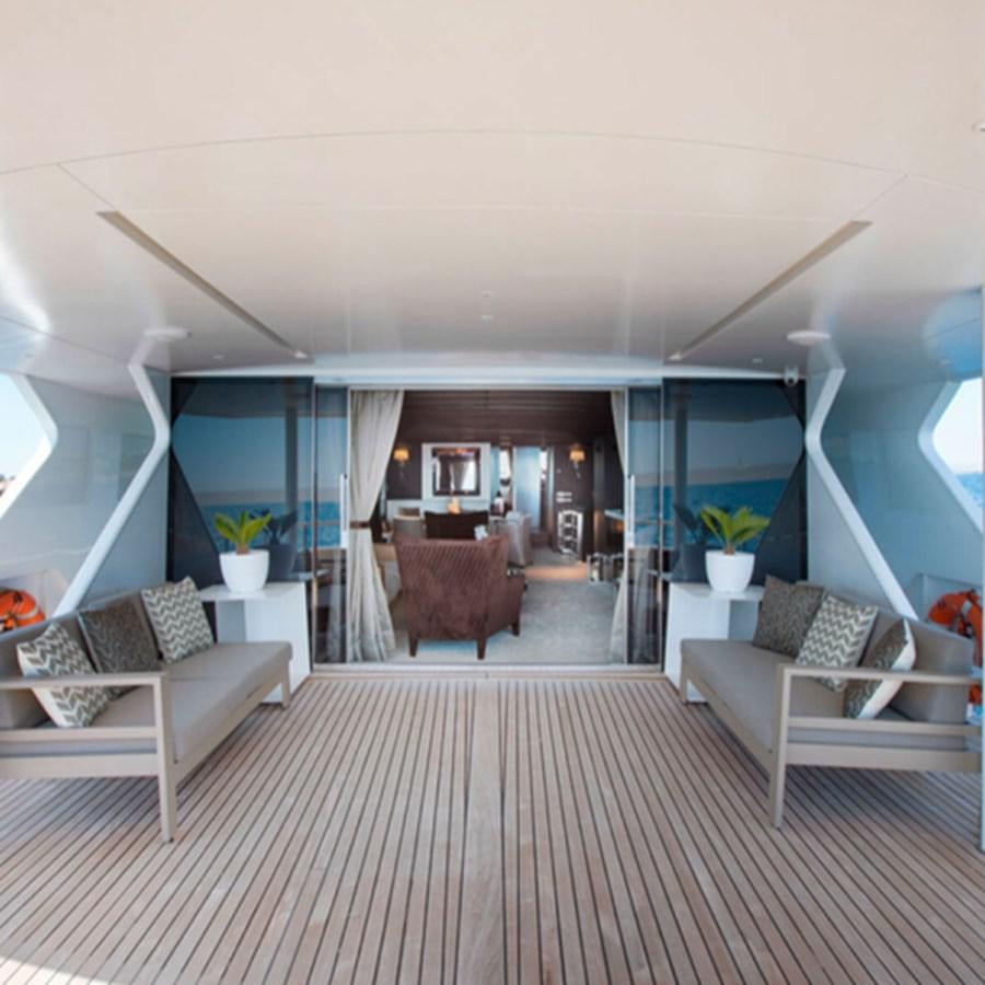 a room with a couch and a table and chairs aboard RA Yacht for Sale