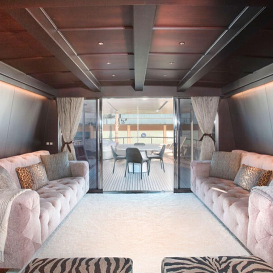 a living room with a large patio aboard RA Yacht for Sale