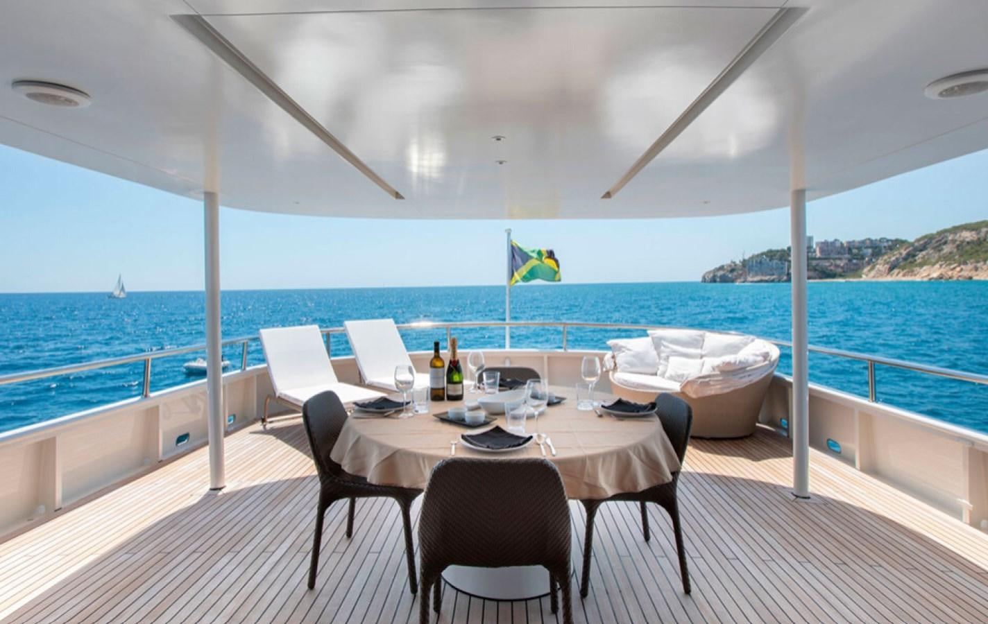 a table set for a meal on a boat aboard RA Yacht for Sale