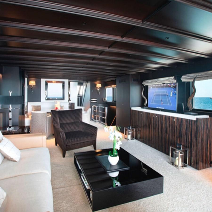 a room with a couch and a tv aboard RA Yacht for Sale