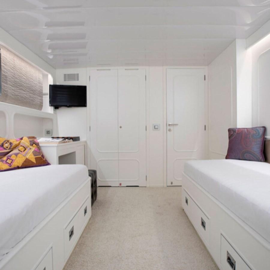 a small white kitchen aboard RA Yacht for Sale