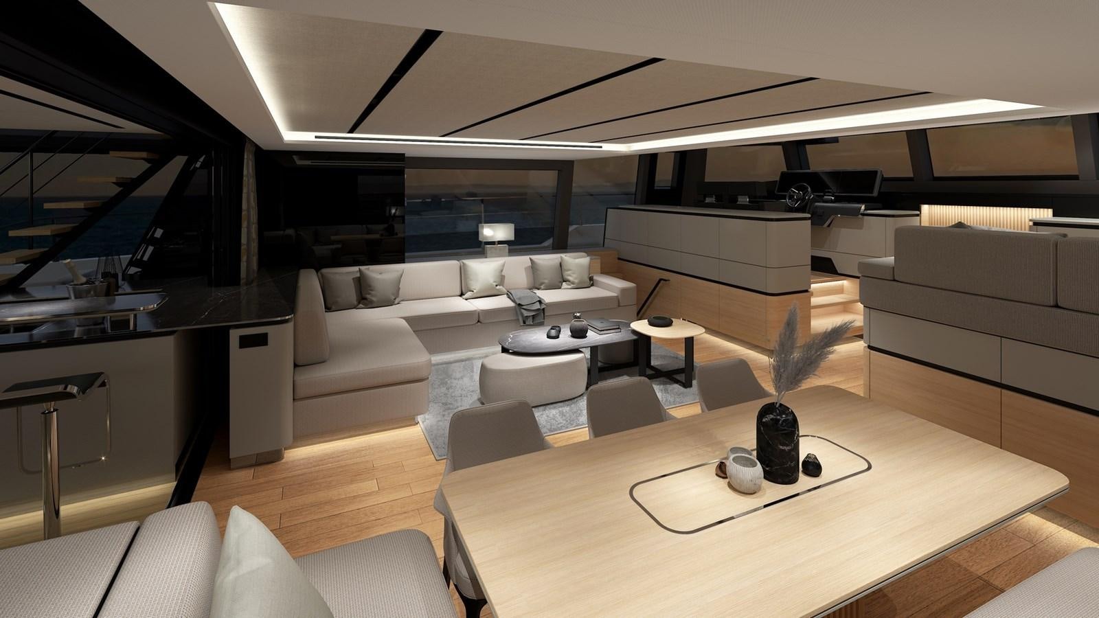 a room with a couch and a coffee table aboard SERENITY 72 POWER CATAMARAN Yacht for Sale