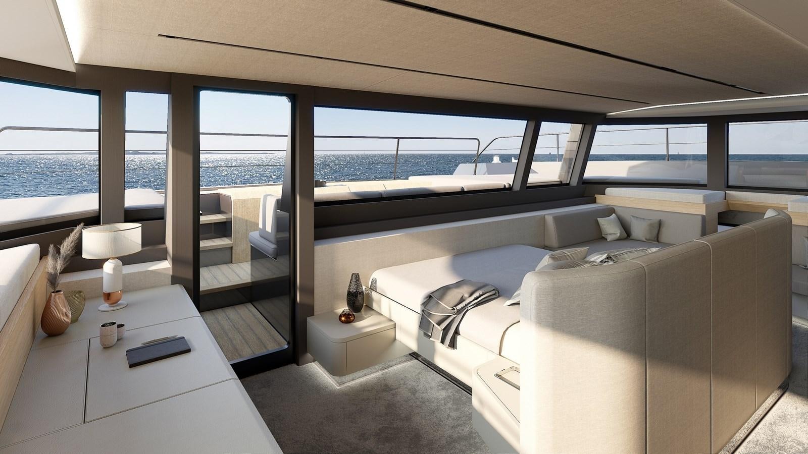 a room with a couch and a table and a window aboard SERENITY 72 POWER CATAMARAN Yacht for Sale