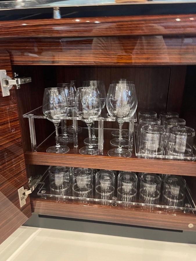 a group of glasses on a shelf aboard PERRI BEACH Yacht for Sale