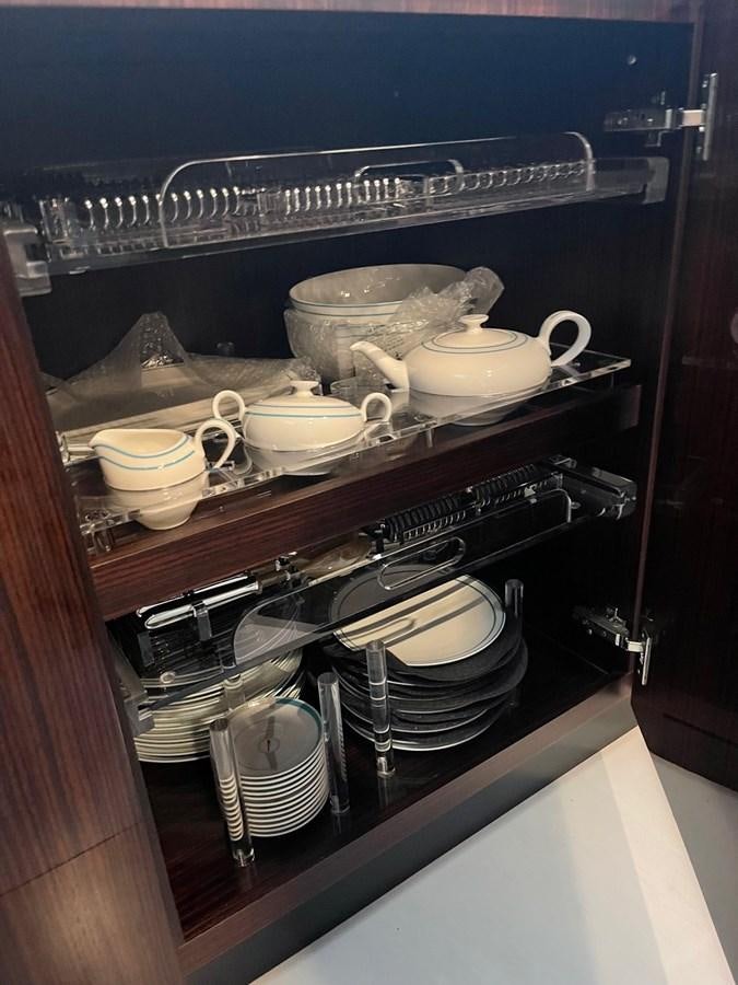 a shelf with many dishes on it aboard PERRI BEACH Yacht for Sale