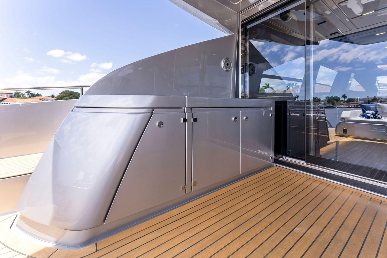 a large silver boat on a deck aboard PERRI BEACH Yacht for Sale