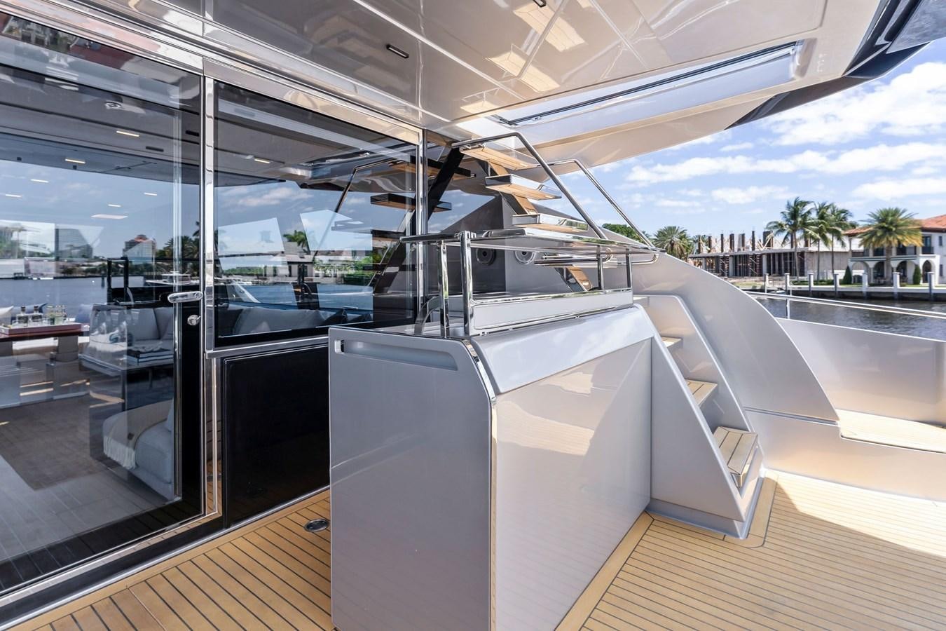 a large white boat on a deck aboard PERRI BEACH Yacht for Sale