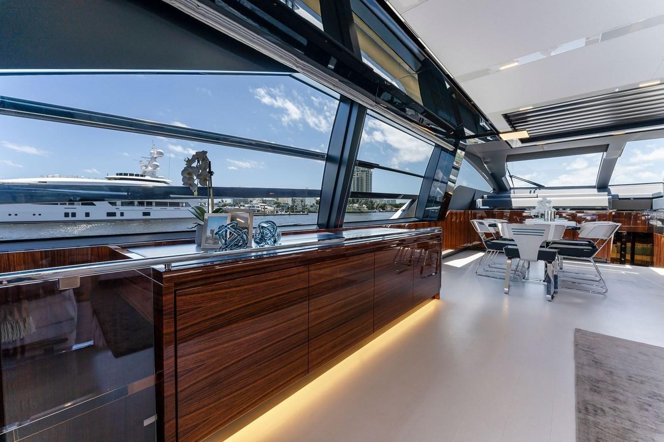 a room with a table and chairs aboard PERRI BEACH Yacht for Sale