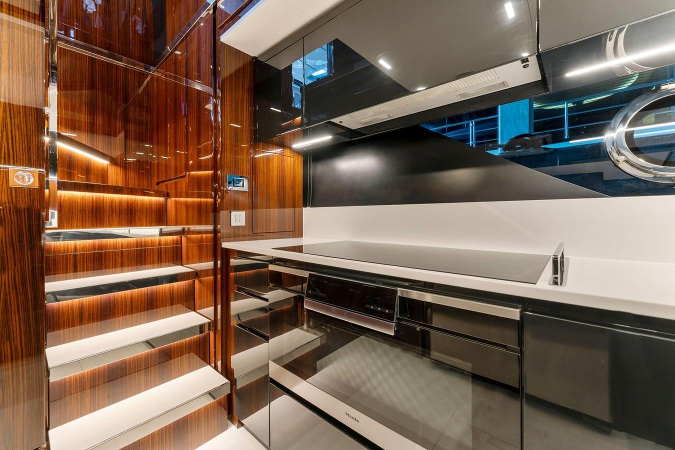 a room with a staircase and a large wood wall aboard PERRI BEACH Yacht for Sale