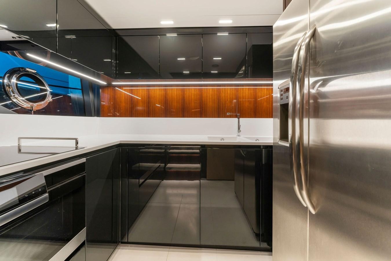 a large room with a few stainless steel appliances aboard PERRI BEACH Yacht for Sale