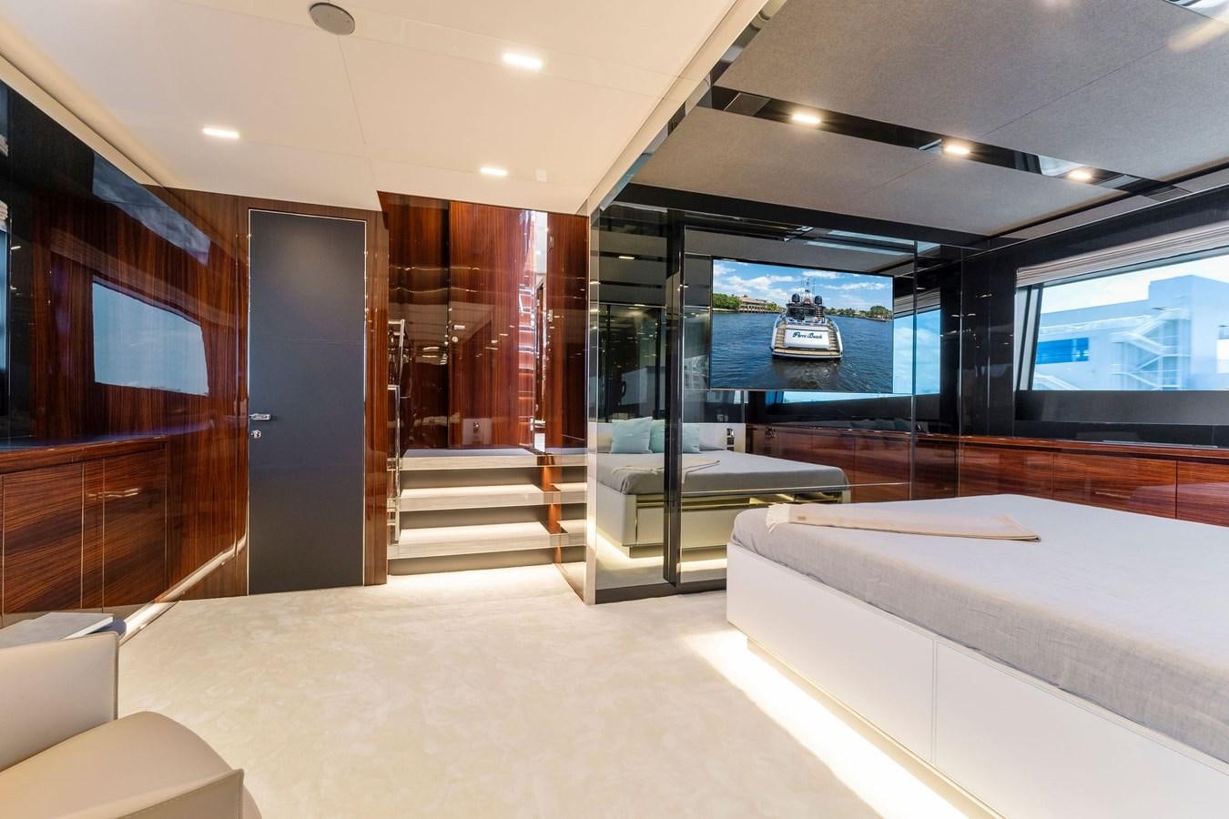 a room with a glass door and a pool table aboard PERRI BEACH Yacht for Sale