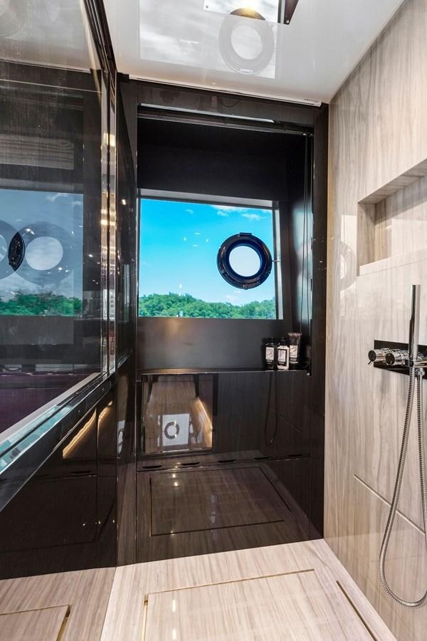 a room with a large window and a wood floor aboard PERRI BEACH Yacht for Sale