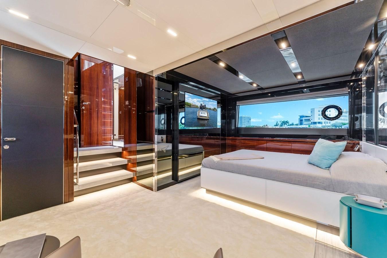 a room with a bed and a couch aboard PERRI BEACH Yacht for Sale