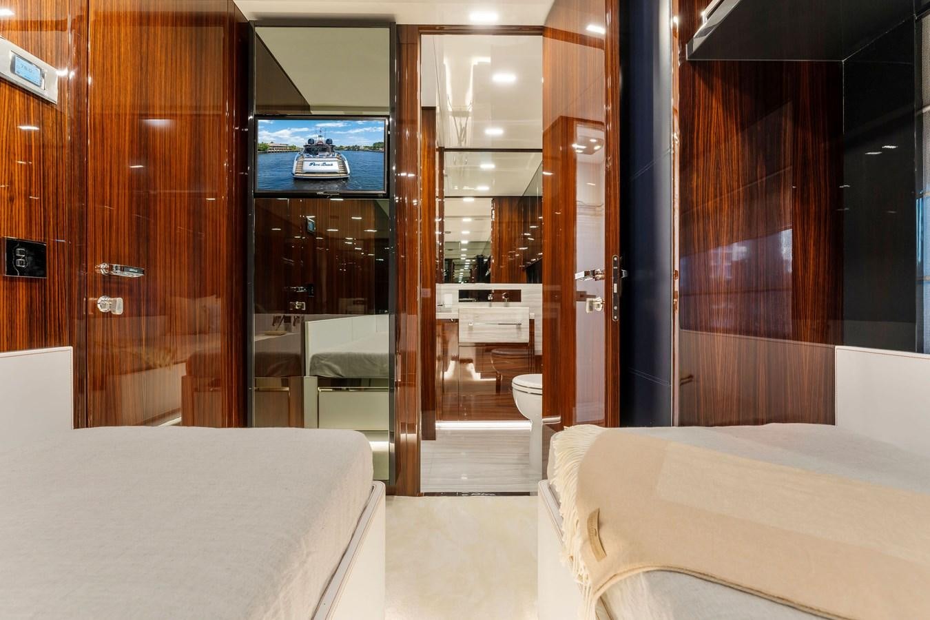 a room with a bed and a mirror aboard PERRI BEACH Yacht for Sale