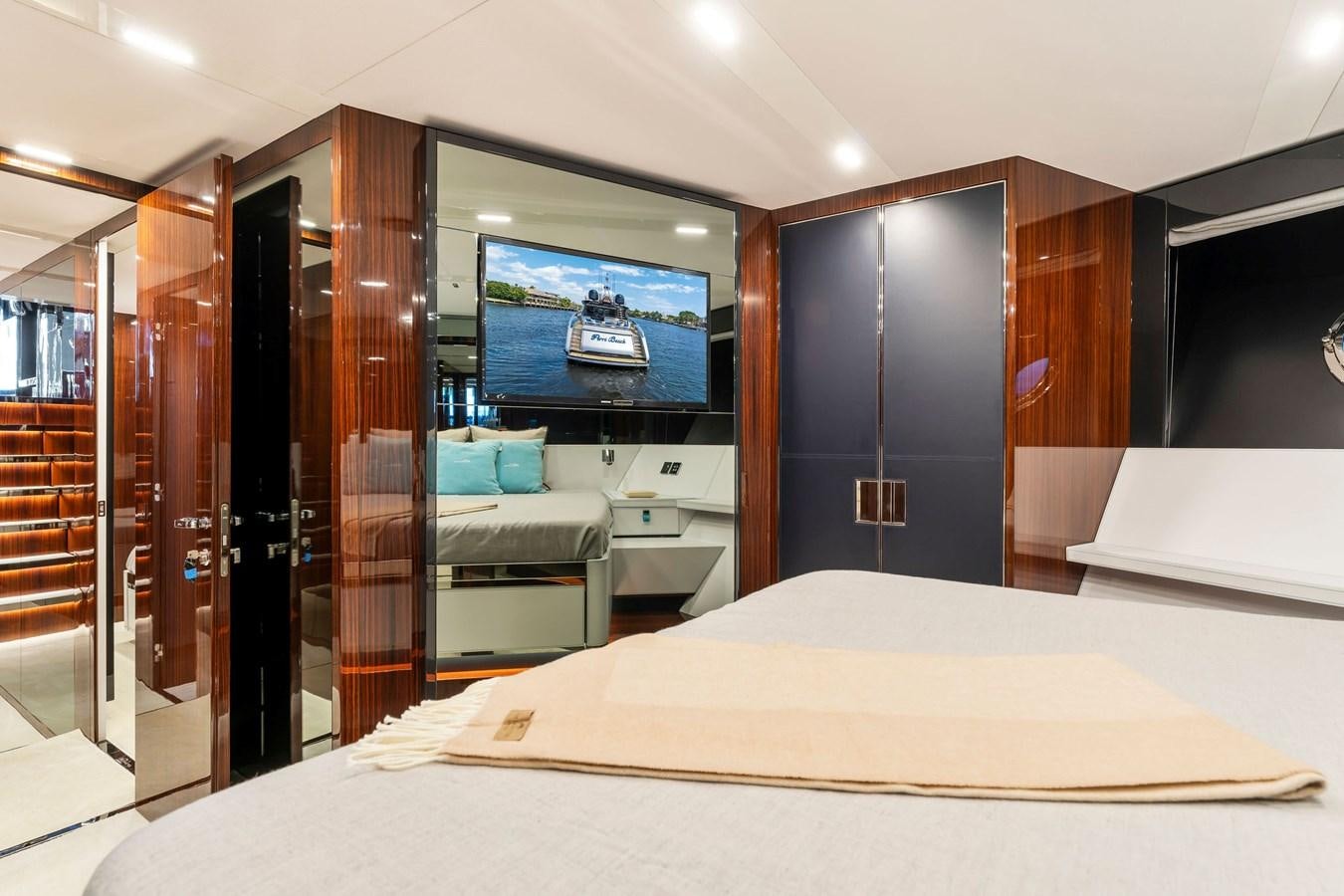 a room with a bed and a television aboard PERRI BEACH Yacht for Sale