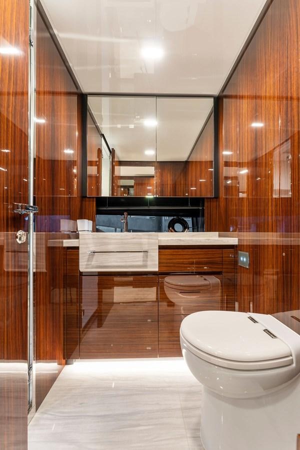 a bathroom with a toilet and sink aboard PERRI BEACH Yacht for Sale