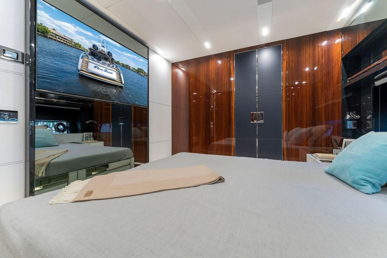 a room with a bed and a television aboard PERRI BEACH Yacht for Sale