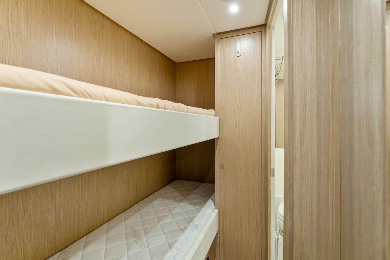 a room with a bed and a door aboard PERRI BEACH Yacht for Sale