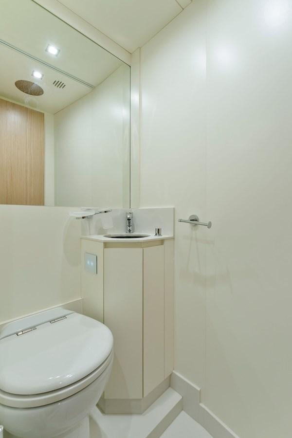 a bathroom with a toilet and sink aboard PERRI BEACH Yacht for Sale
