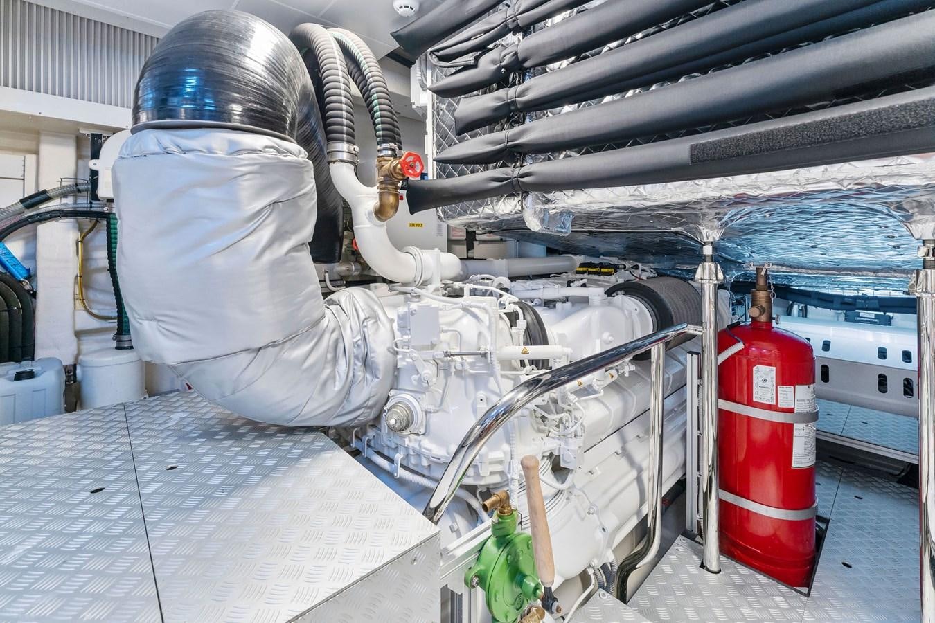 a person in a white coat and helmet working in a factory aboard PERRI BEACH Yacht for Sale
